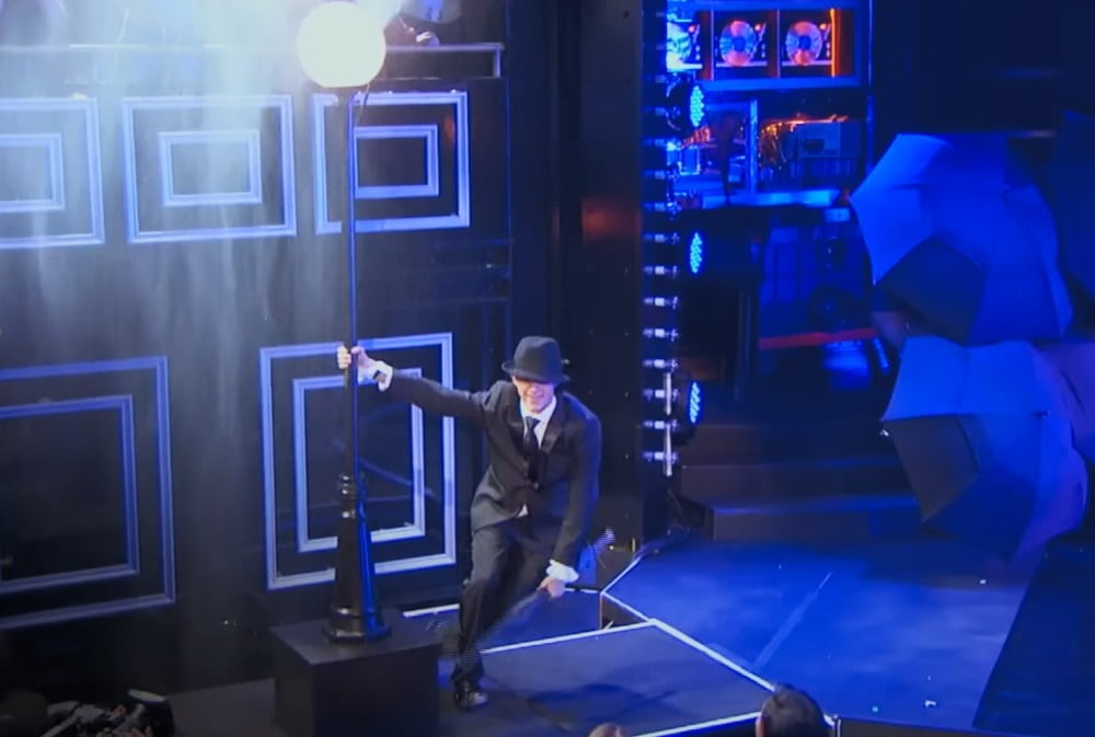 Tom Holland umbrella singing in the rain