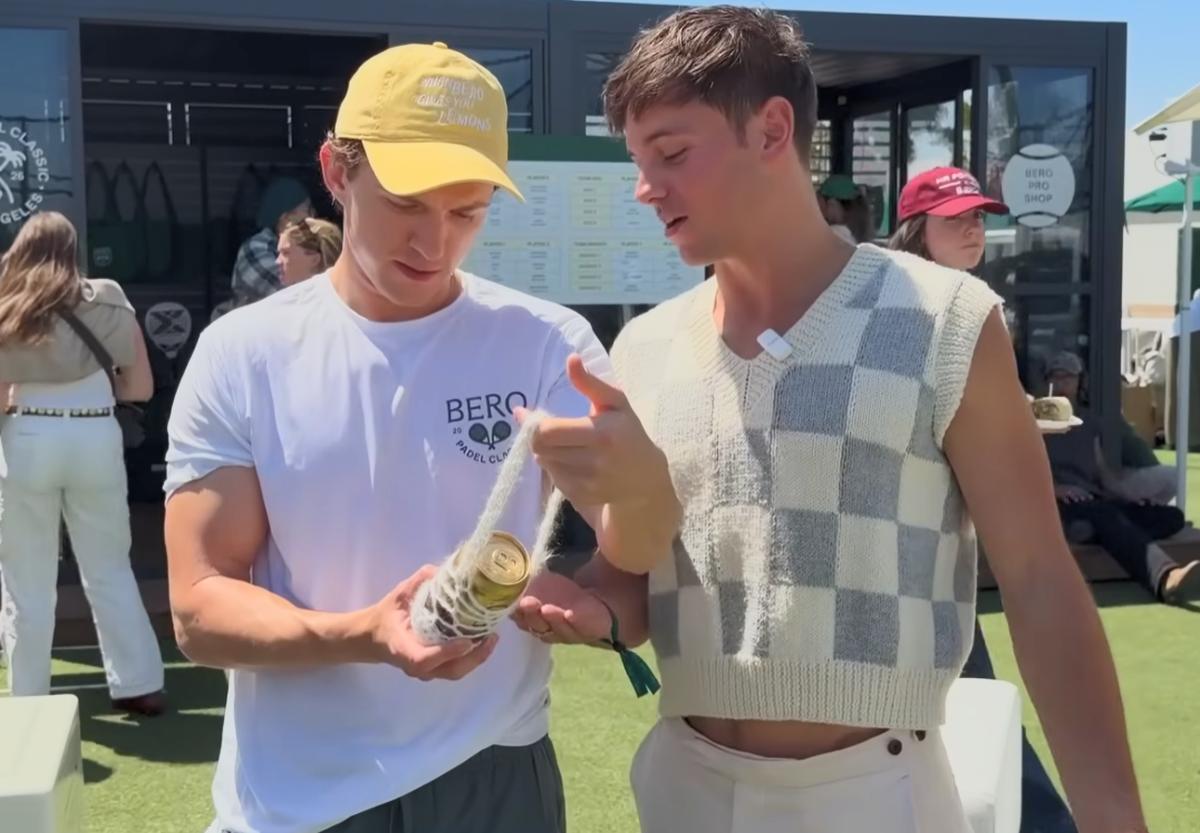 Tom Daley presenting bero bag to Tom Holland