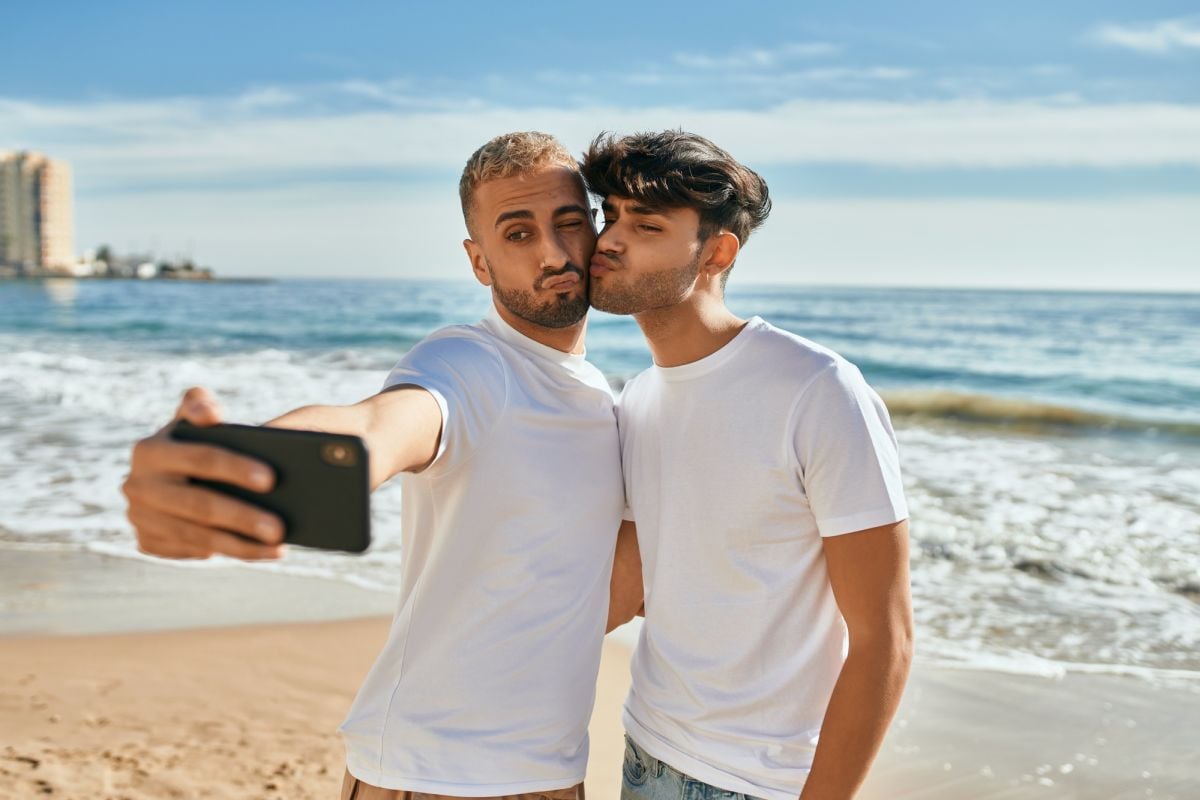 Gay couple taking selfie