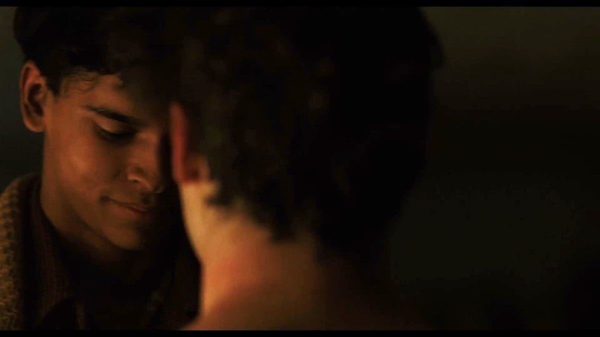 D'Pharaoh Woon-A-Tai and Fred Hechinger with their foreheads touching in the dark