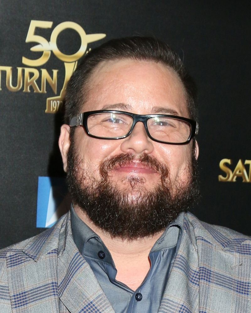 Chaz Bono in glasses and a plaid suit at the Saturn Awards