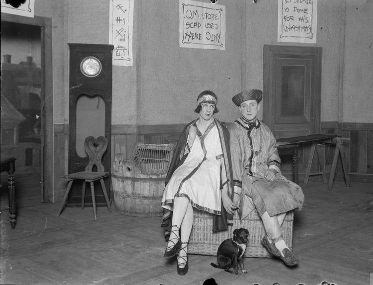 Two British soldiers in costume for an army pantomime of Aladdin in Lille, one dressed as a woman
