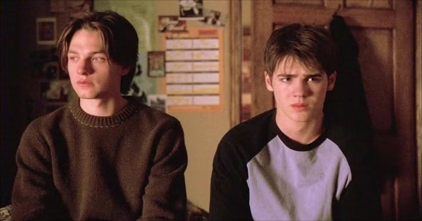Gregory Smith and Steven R. McQueen as Ephram and Kyle sitting side by side in a bedroom