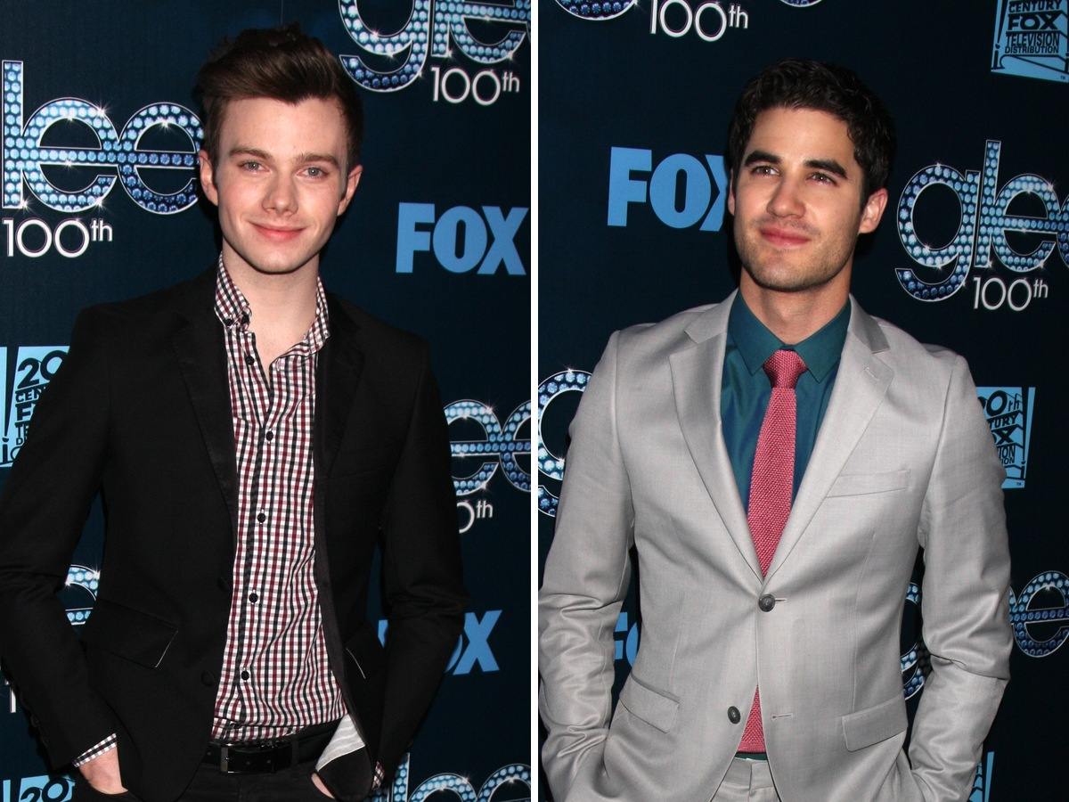 Side-by-side photos of Chris Colfer in a black blazer and checked shirt and Darren Criss in a light grey suit at the Glee 100th episode party
