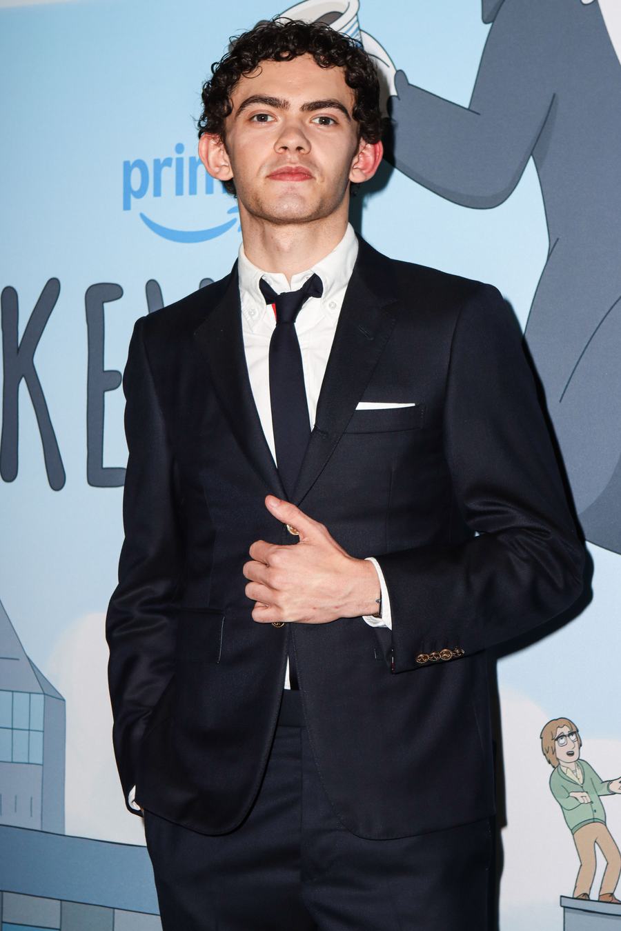 Joe Locke in a navy suit and tie at a screening in New York