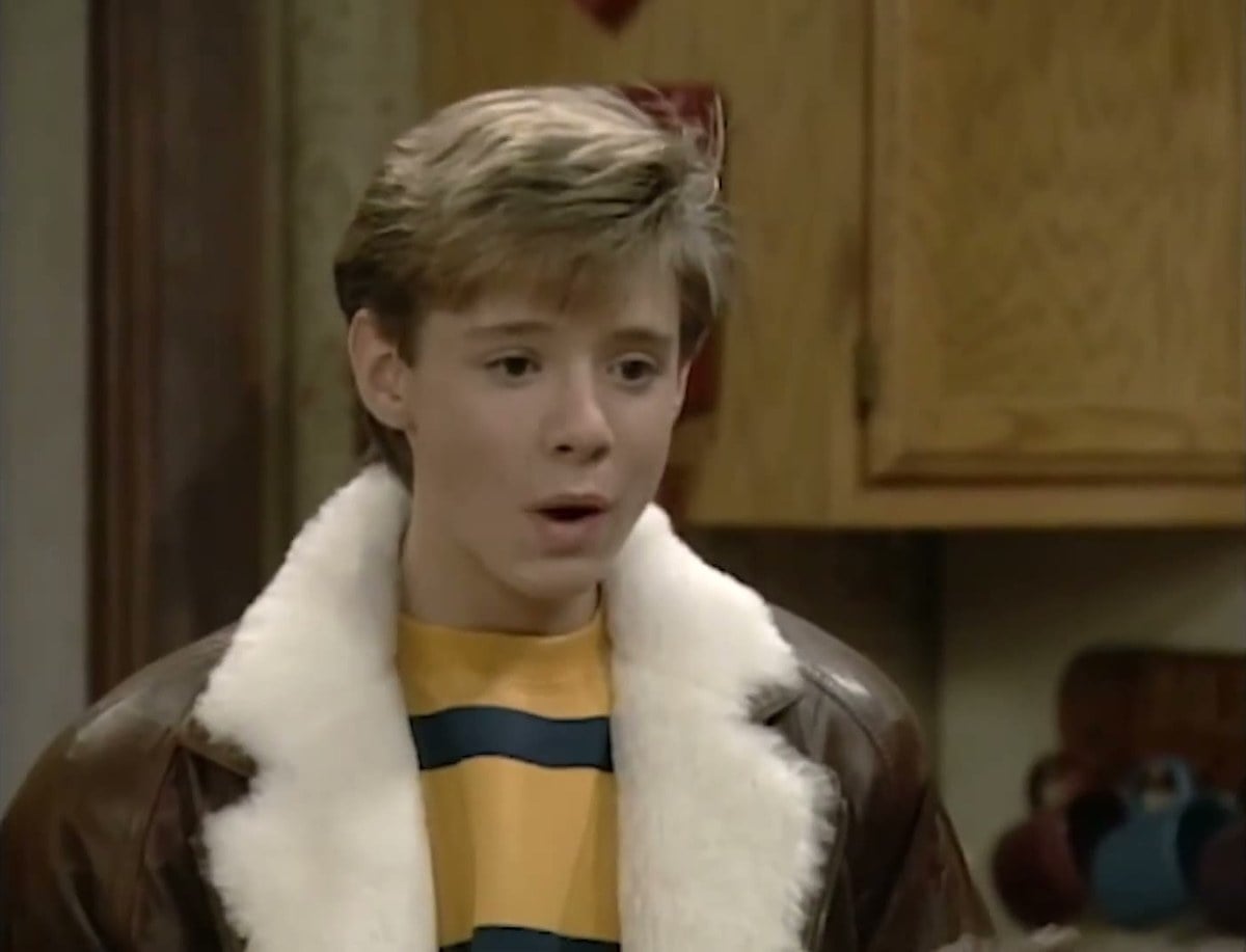 A teenage Danny Pintauro as Jonathan Bower in a shearling jacket in the Who's the Boss? kitchen